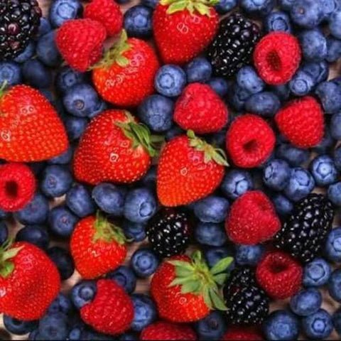 Assorted fresh berries including strawberries, blueberries, and raspberries in a clear container for CBE Mix Berries by Flavour World SA.