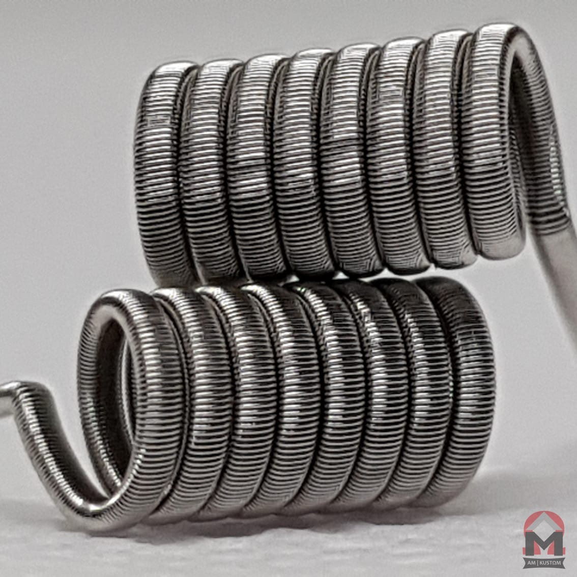 Fused Clapton coil from AM Kustohm by Flavour World SA, 27/38ga, 8-wrap, 0.28 ohm, for vaping devices