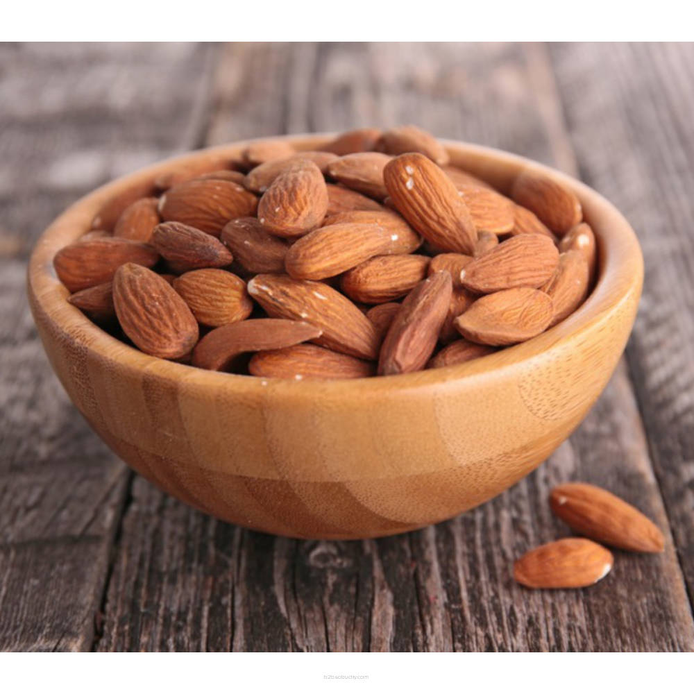 Raw SSA almonds from Flavour World SA, showcasing a close-up of light brown, textured almonds in a natural state.