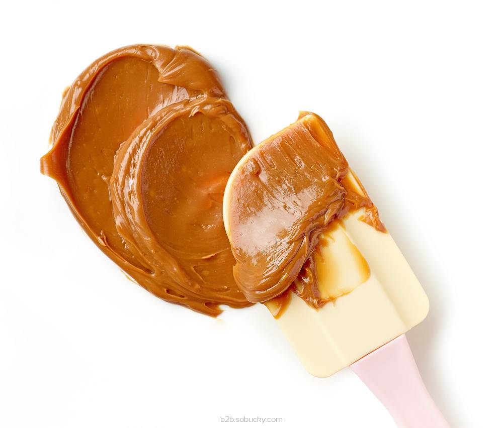 Rich butterscotch flavor from Flavour World SA in a bottle, showcasing its golden color and smooth texture.
