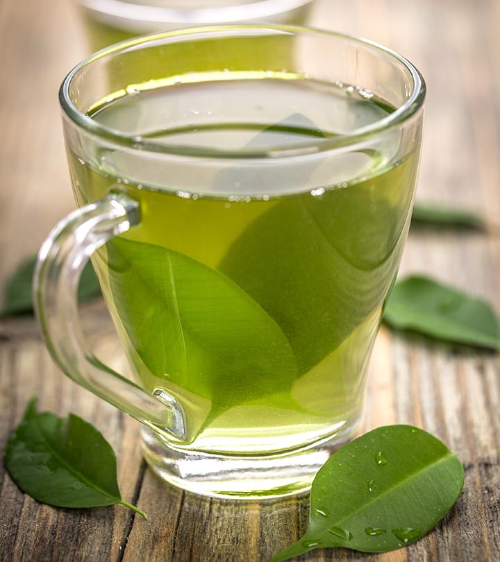 Bright green tea leaves from Flavour World SA's SSA Green Tea in a clear glass jar, showcasing fresh, vibrant tea leaves.