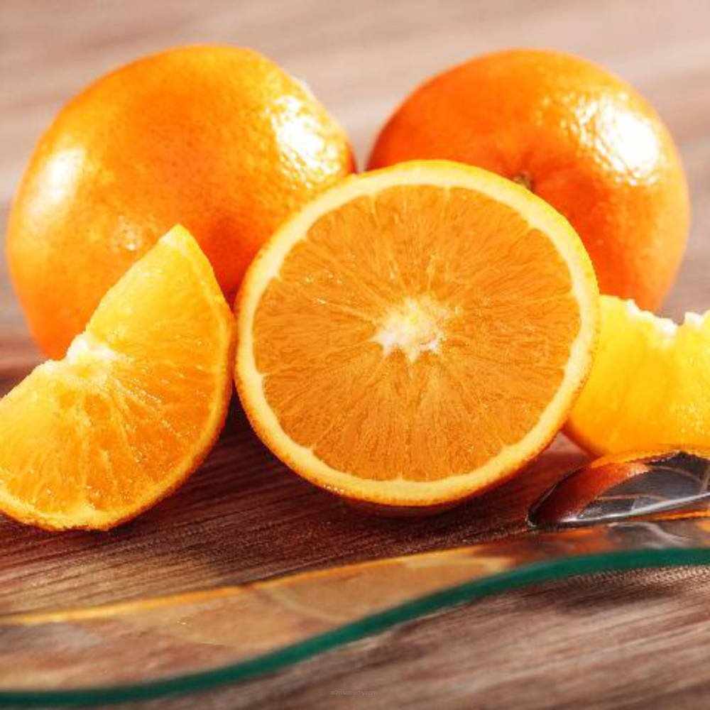 Fresh Juicy Orange from SSA by Flavour World SA, showing vibrant orange fruit with textured peel and bright interior.