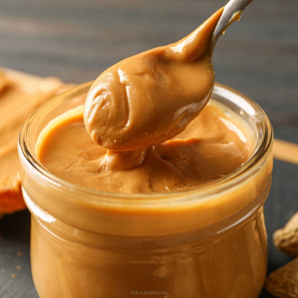Creamy peanut butter jar from Flavour World SA, showing the label and smooth texture of the SSA peanut butter product.