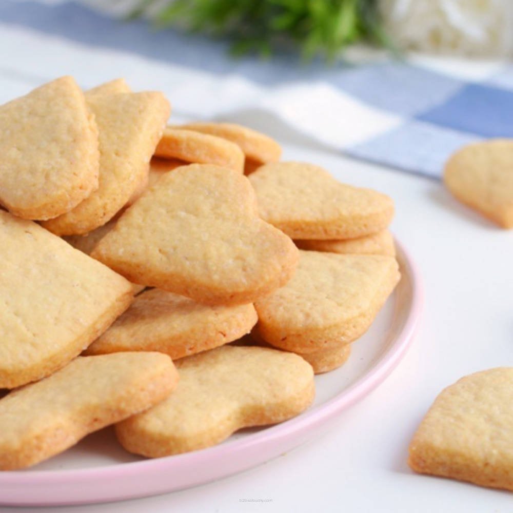 Golden shortbread cookies from Flavour World SA, showcasing buttery, crumbly texture and classic square shape.
