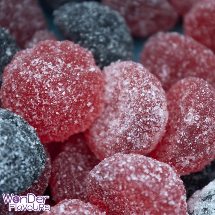 Wonder Flavours Sour Blue Raspberry Candy concentrated flavor in a small bottle, shown with bright blue raspberry candy.
